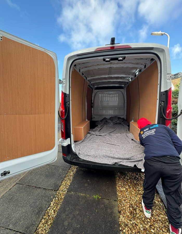 Professional house removals team in Bristol loading furniture into a van el removals